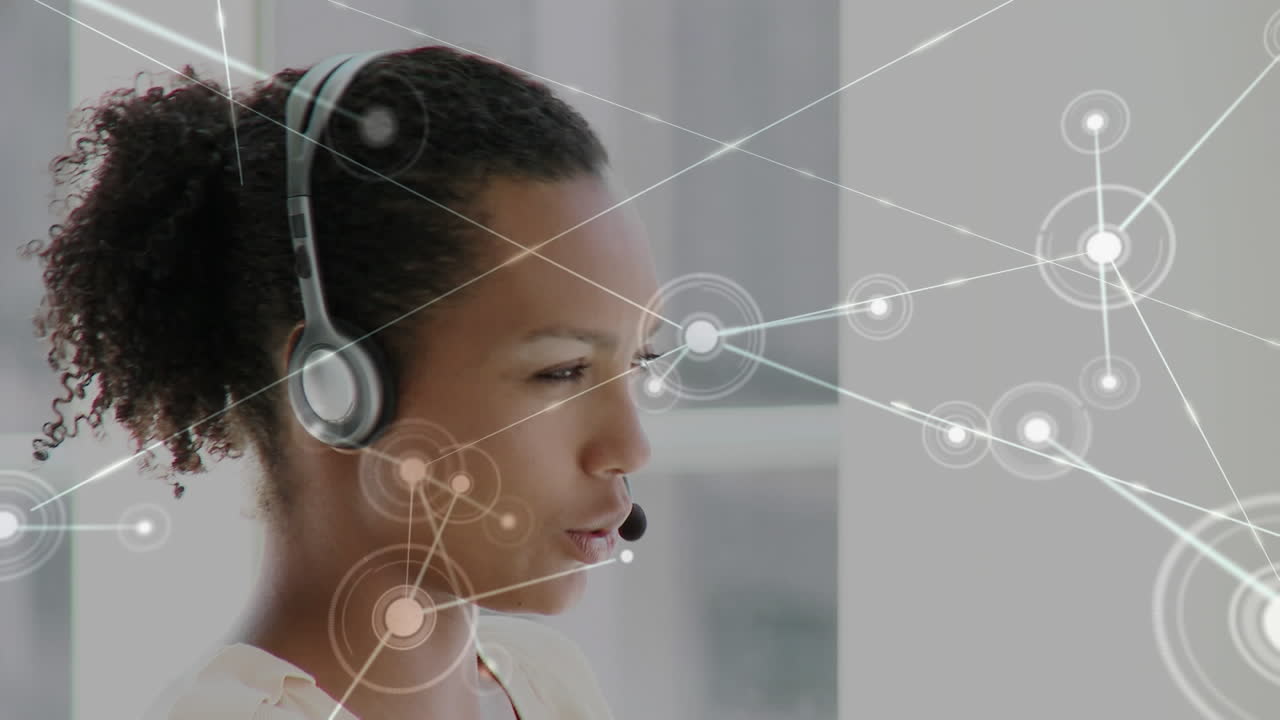Animation of network of connections over business woman using phone headsets