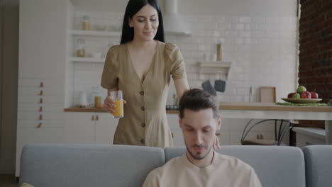 couple enjoying a drink together at home