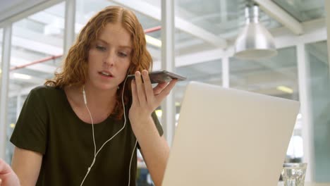 businesswoman talking on mobile phone at desk 4k