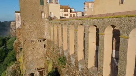 overview of pitigliano medieval town and fortress on tuff cliff side in tuscany, italy