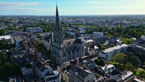 smooth panning aerial movement around the saint-clement church at daytime, nantes, france