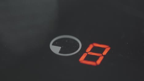 setting the temperature on an electric stovetop