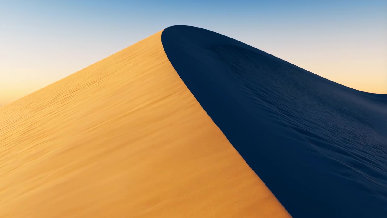 Wide close view of single desert sand dune with sunlit near face in warm golden amber tones and opposite face in deep blue shadow, divided by sharp diagonal crest across soft gradient sky