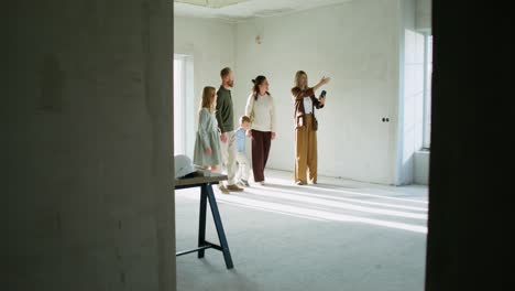 family viewing a new home under construction