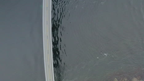 slow top down aerial of storeseisund bridge in more and romsdal county, norway