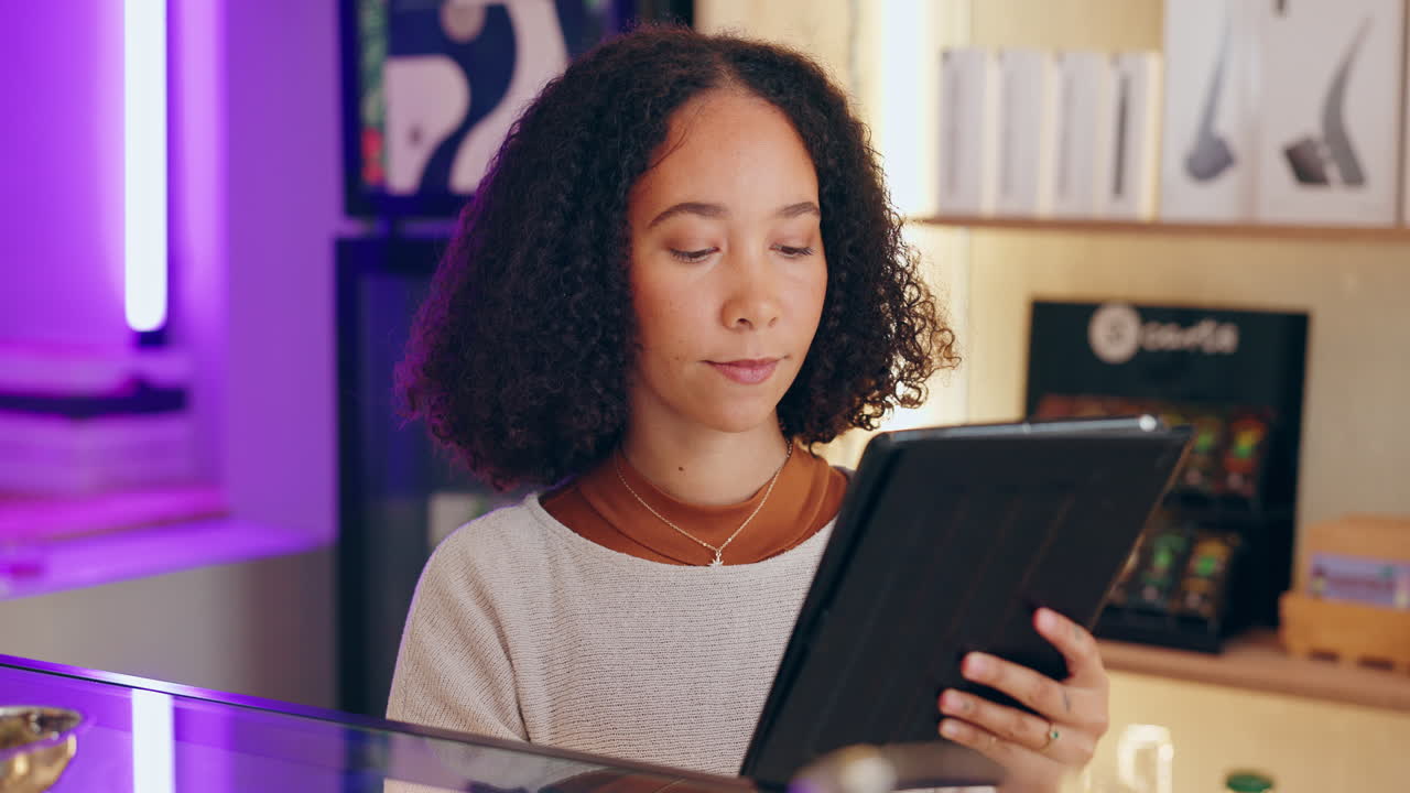 Woman using tablet in cafe