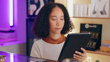 woman using tablet in cafe