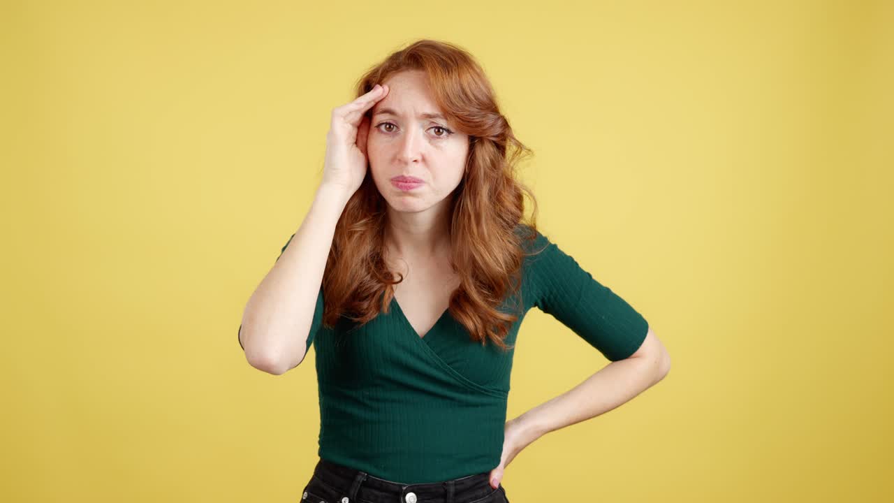 Young redhead woman expressing various negative emotions