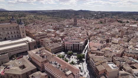 Plaza-de-Zocodover-in-Toledo-Spain,-aerial-arc-cityscape-shot