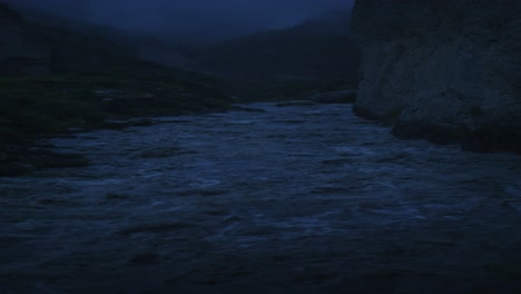 misty mountain river at night