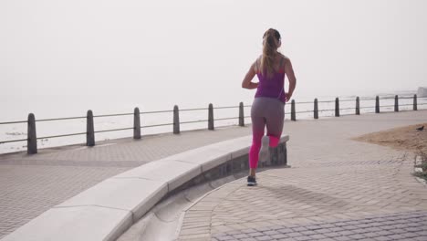 caucasian woman running on the docks