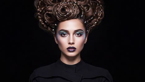 captivating portrait of a model with exquisite braided hair and dramatic makeup in a dark setting, highlighting the fusion of artistry and fashion
