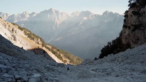 looking down the valley of the alps in albania at sunset