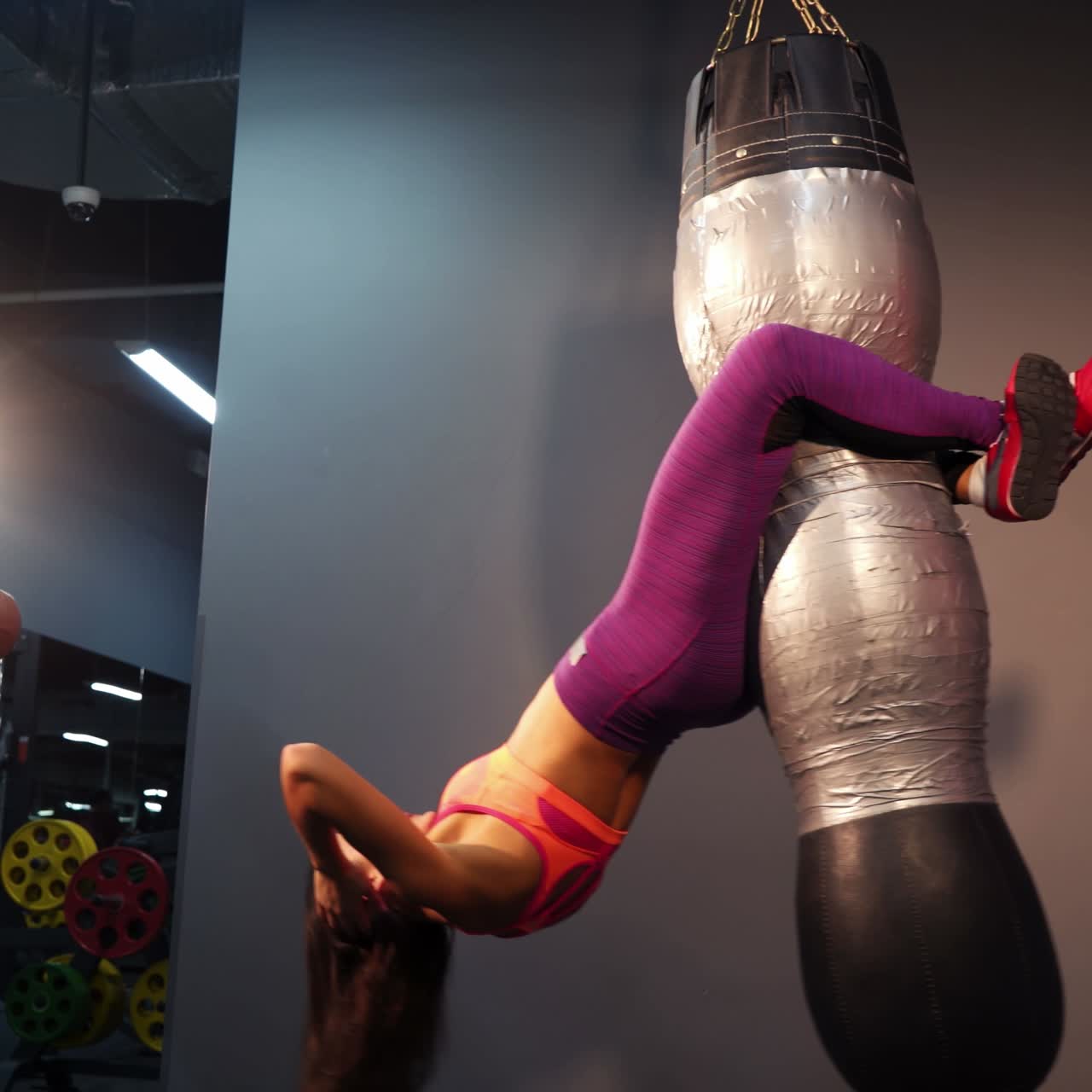 Attractive young girl doing exercises on abdominal muscles in a gym. Ideal press. Healthy lifestyle.