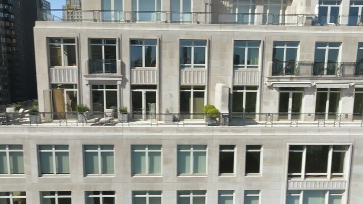Aerial tracking shot revealing the West 61th street of sunny Manhattan, NY