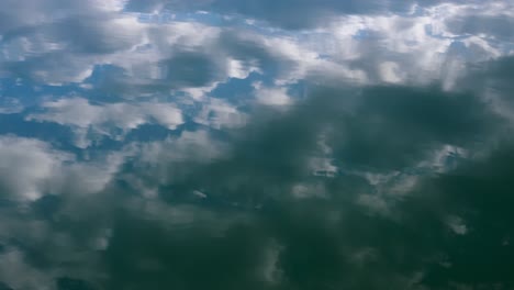 Clouds-mirroring-on-the-calm-water-during-sunset