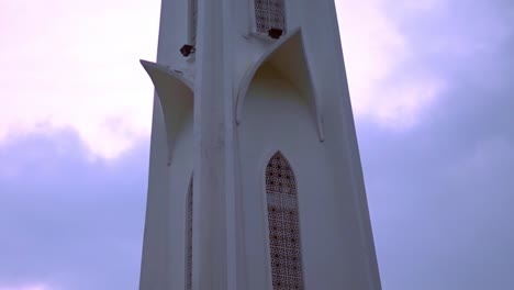 ivory white tower beside malacca straits mosque in melaka kuala lumpur malaysia - tilted up medium shot