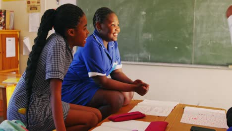 schoolgirls talking during a break at a township school 4k