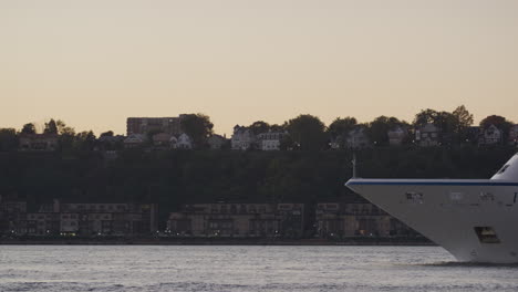 cruise ship insignia sailing at sunset