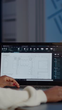 vertical video african engineer constructor designer architect analysing new bluilding plan