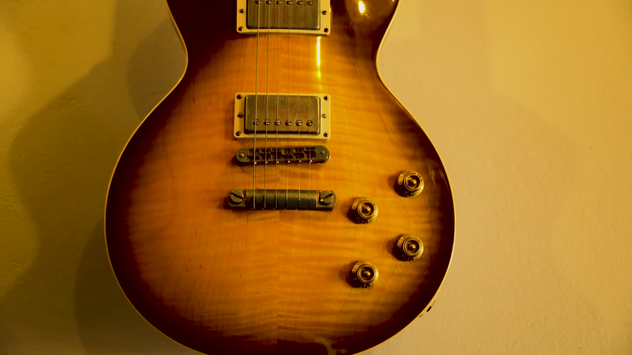 In a cozy and inviting ambiance, a timeless classic electric guitar rests securely in its stand