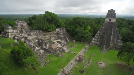 great aerial shot over the tikal pyramids in guatemala 10