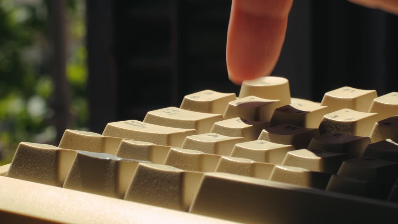 Man working and gaming on retro computer PC, IT engineer with vintage computer at home, using old fashion technology, close up of retro setup.