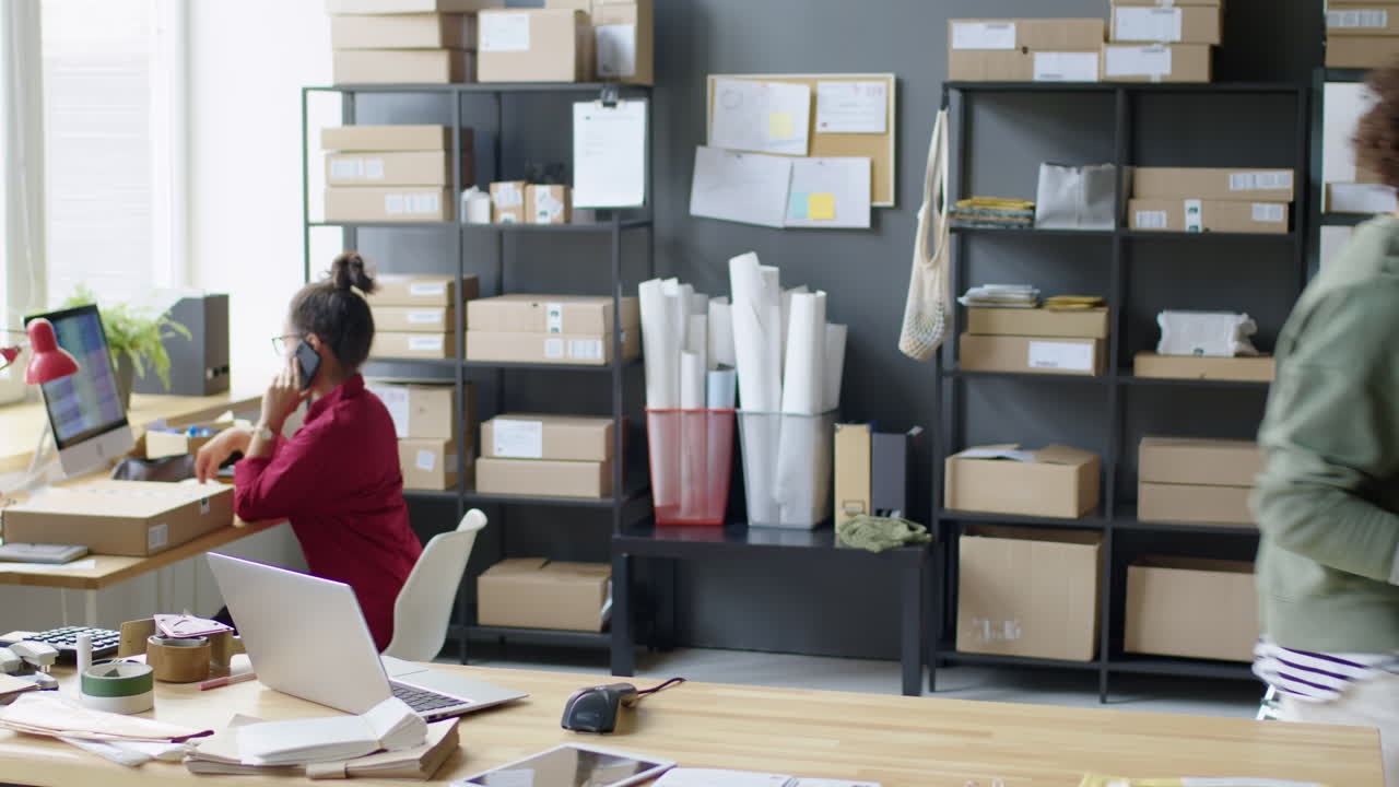 Office Scene with People, Boxes, and Laptops