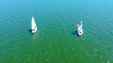 aerial view of sailboats with american flag at wallenpaupack lake, pennsylvania, usa