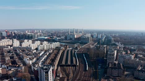 circling drone shot over london railway tracks battersea power station grosvenor bridge