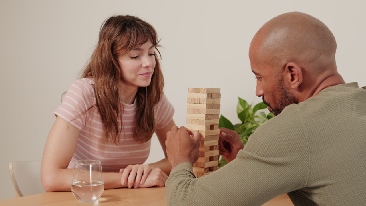 Couple Playing Jenga at Home