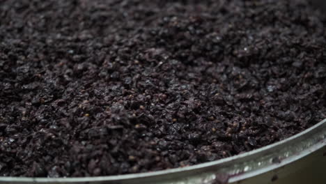 winemaking process: grapes in fermentation tank