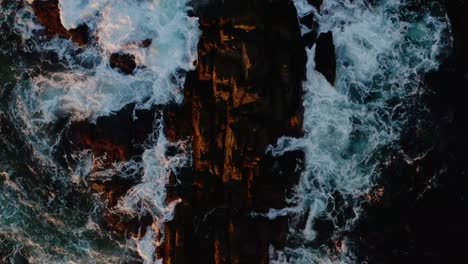 Aerial-view-ocean-crashing-on-the-rocks-in