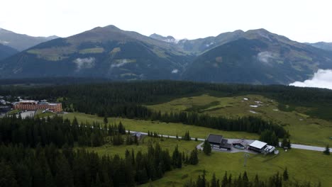 drone flying towards a small austrian ski resort in summer season