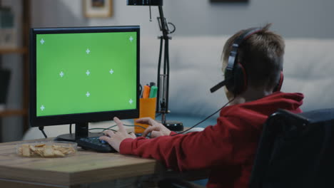 boy in a wheelchair playing video games