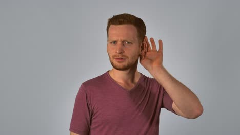 ginger male shows sign listens attentively