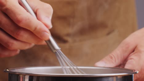chef cooking spanish traditional food, catalonian dessert, crema catalana, catalan cream, spanish dessert close up, cooking.