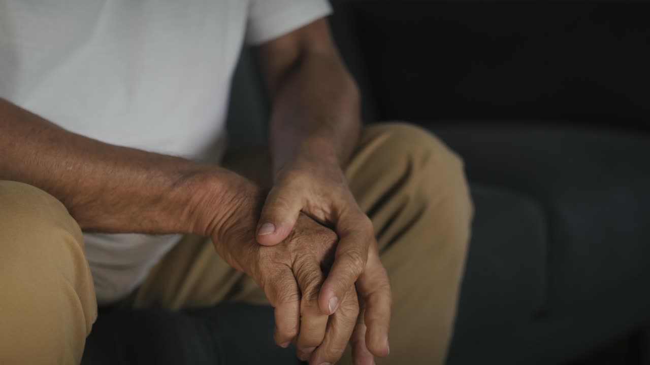 Close up of nervous senior man's hands.
