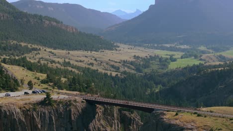 aerial view of a scenic bridge over a mountain valley
