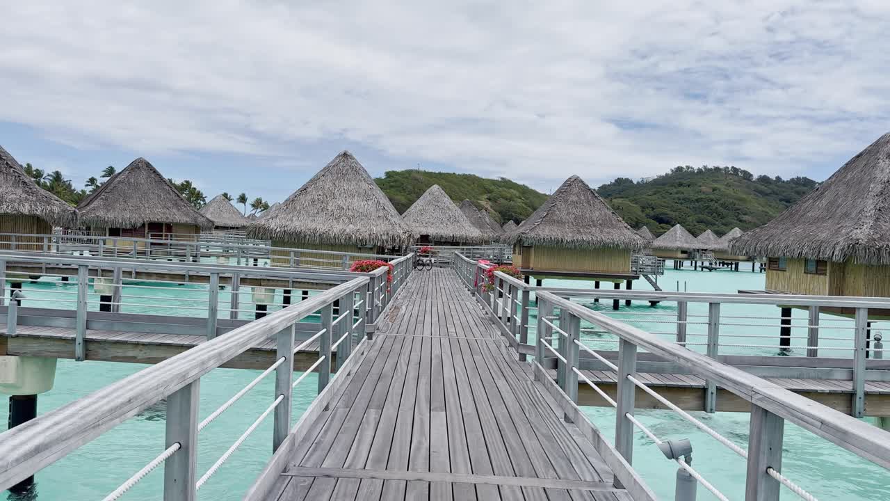 Summer Bora Bora Vacation Resort in French Polynesia with turquoise and aquamarine shallow lagoon clear water