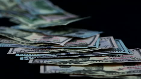 united states dollar bills thrown on black table