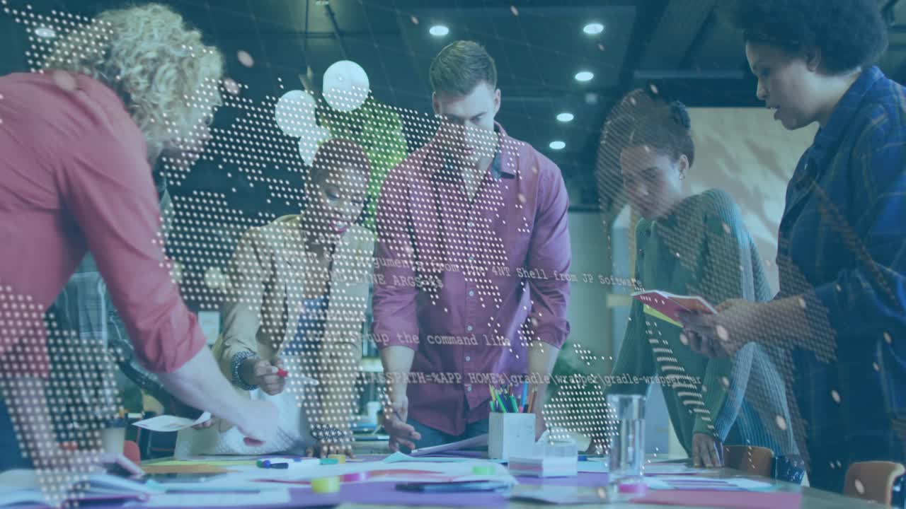 Designers leaning over table sorting mocks while map overlay fading showing info to finalize plan