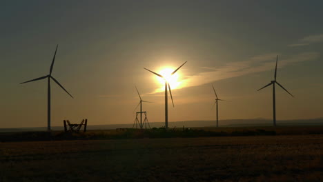scenic view of silhouetted windmills during sunrise in oregon, usa. wide shot