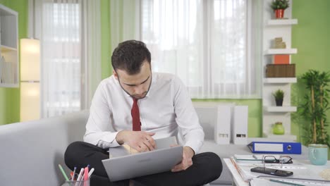 Young-businessman-working-on-laptop.