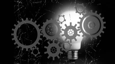 Gears-and-cogs-animation-over-illuminated-light-bulb-in-dark-background