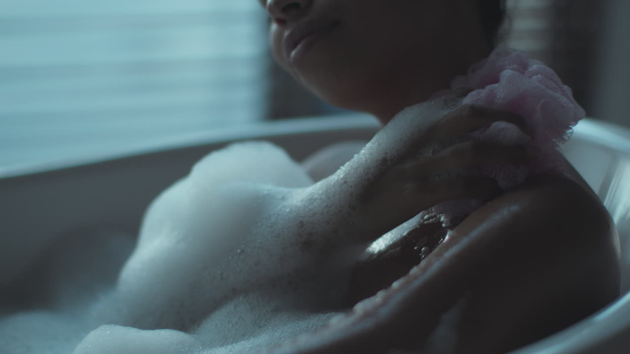Woman enjoying a relaxing bubble bath