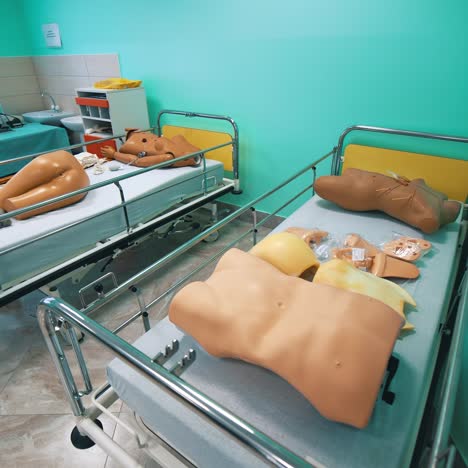mannequin models in hospital beds. plastic dummy parts of patient's body to perform practice exercises in training room in the university. faculty of health