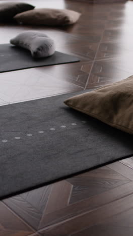 yoga mats and cushions in a studio
