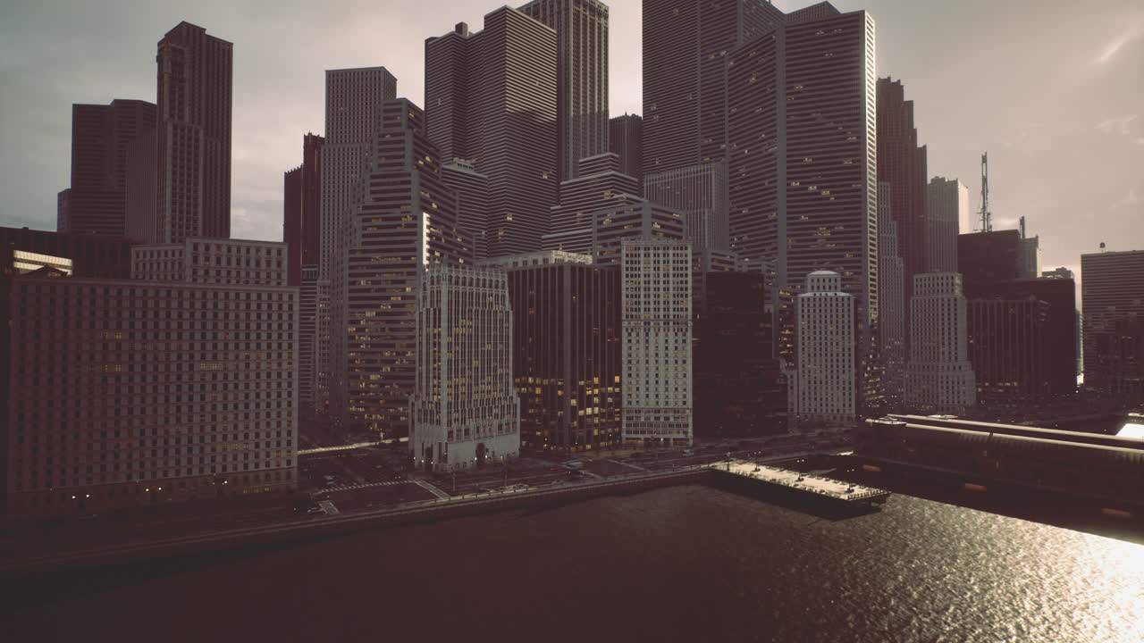 City skyline during twilight with reflections on water near buildings