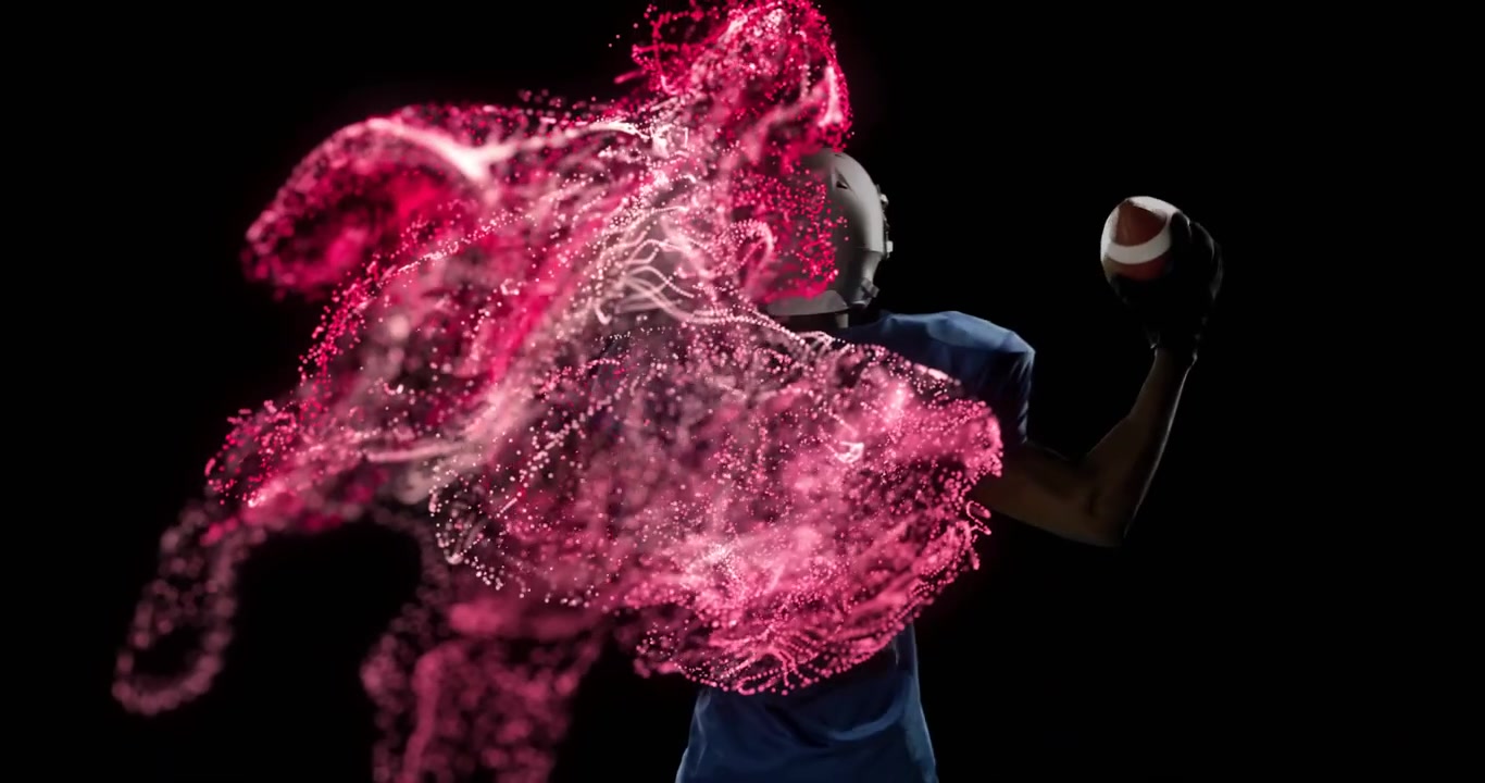 Jugador de fútbol americano con casco levantando el brazo derecho, creando una nube de partículas rojas y blancas, mostrando tecnología deportiva.